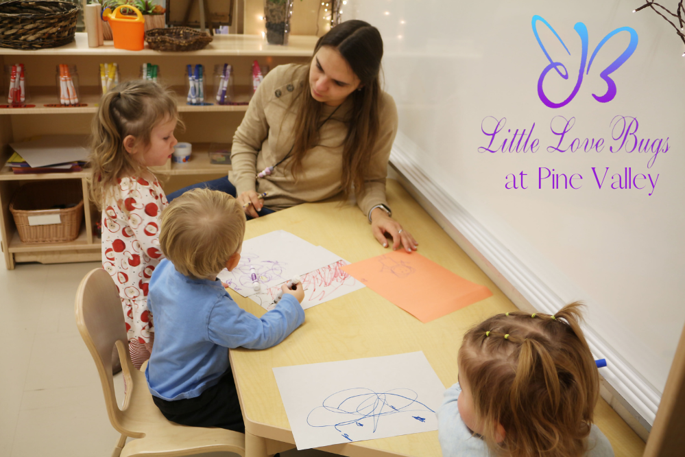 Monica Kenny helps children with art. Monica Kenny helps children with art.